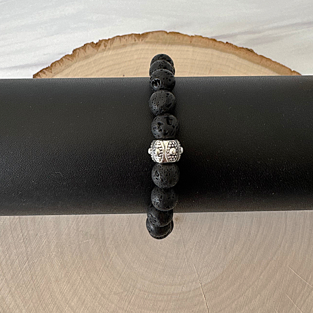 Black Lava Beaded Mens Bracelet with Silver Bead Displayed