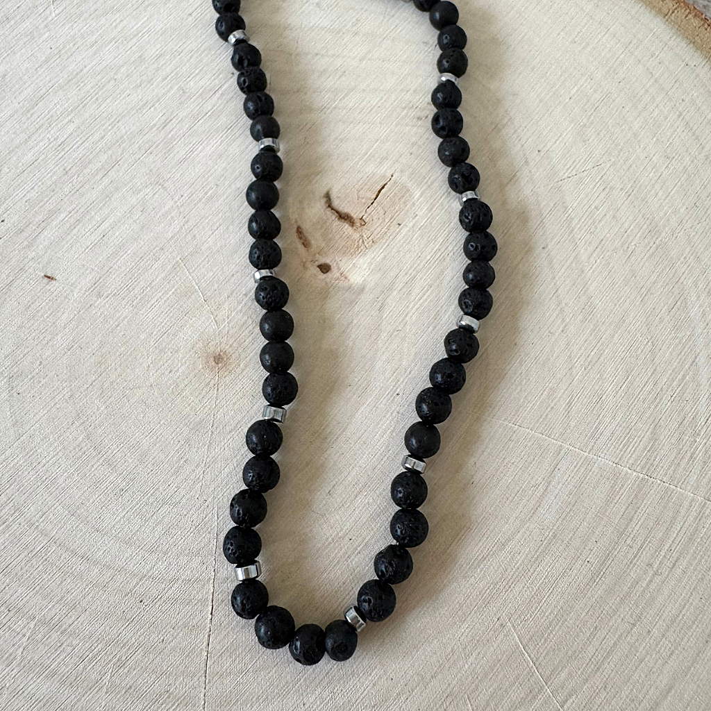 Black Lava and Silver Hematite 5mm Mens Beaded Necklace On Light Wood Table