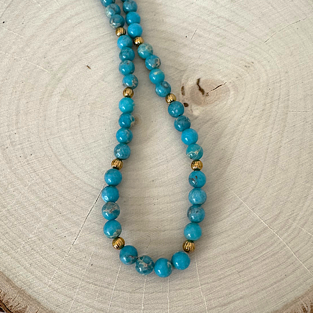 Blue Impression Jasper and Gold Mens Beaded Necklace On Wood
