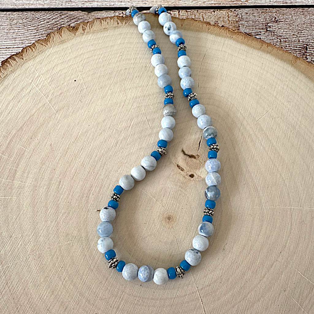 Blue and White Agate with Blue Toho and Silver Beaded Mens Necklace on a wooden surface