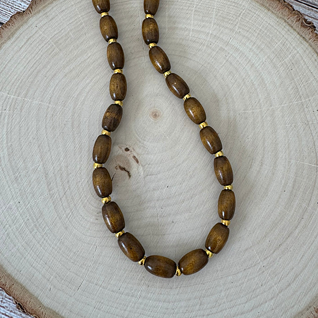 Brown Wood Barrel and Gold Beaded Mens Necklace On Wood