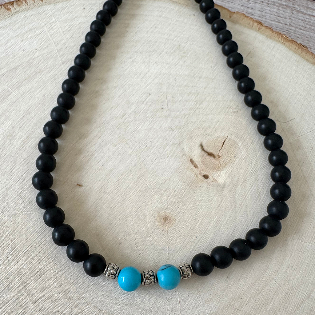 Matte Black Onyx and Turquoise Howlite Mens Beaded Necklace On Light Wood