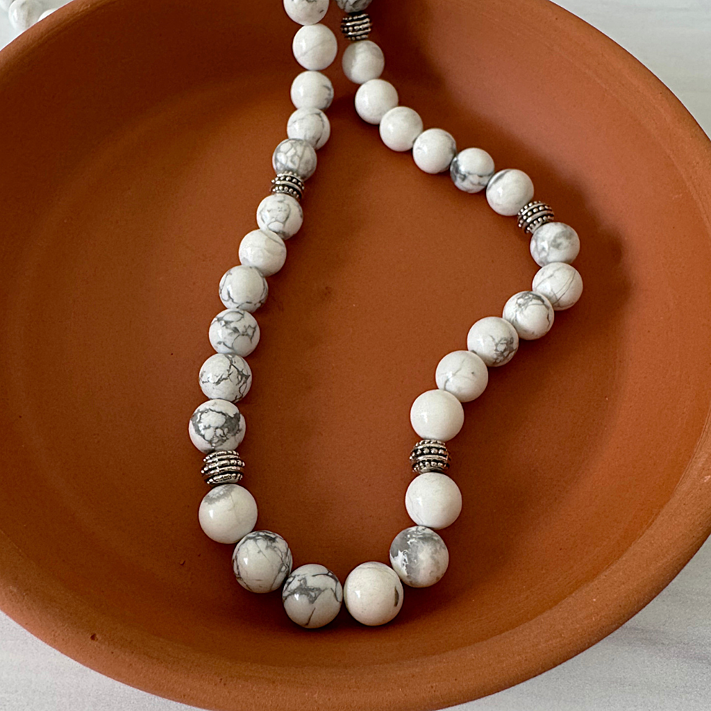 Men's White and Gray Howlite Silver Beaded Necklace Displayed