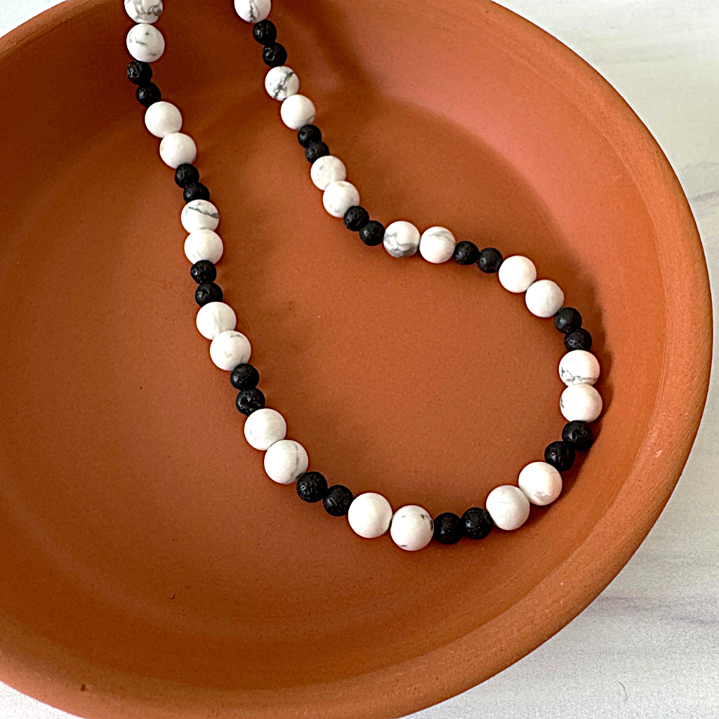 Mens 6mm Howlite and Black Lava Necklace Displayed On Dish