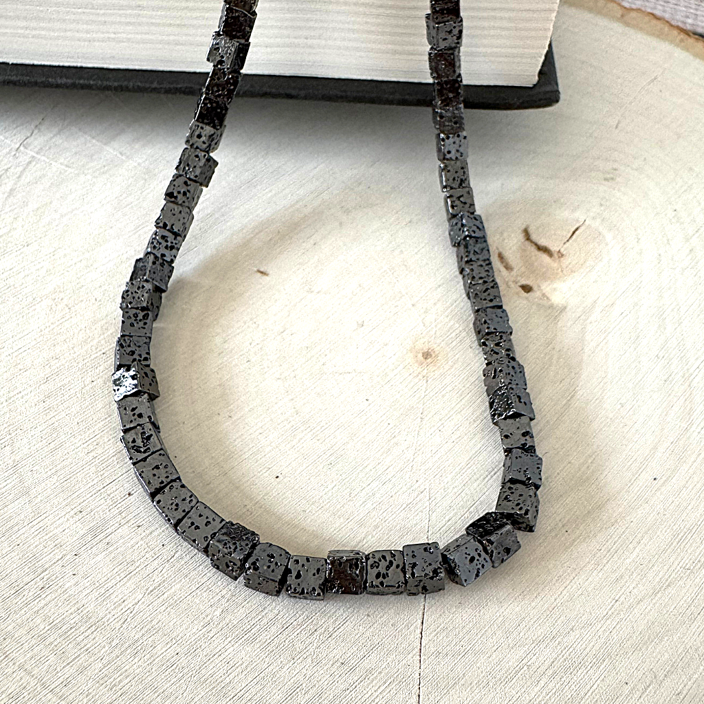 Mens Black Lava Cube Necklace On Wood.