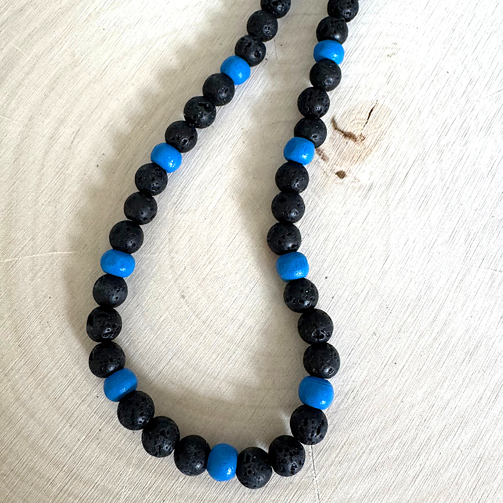Mens Black Lava and Blue Wood Beaded Necklace On Light Wood