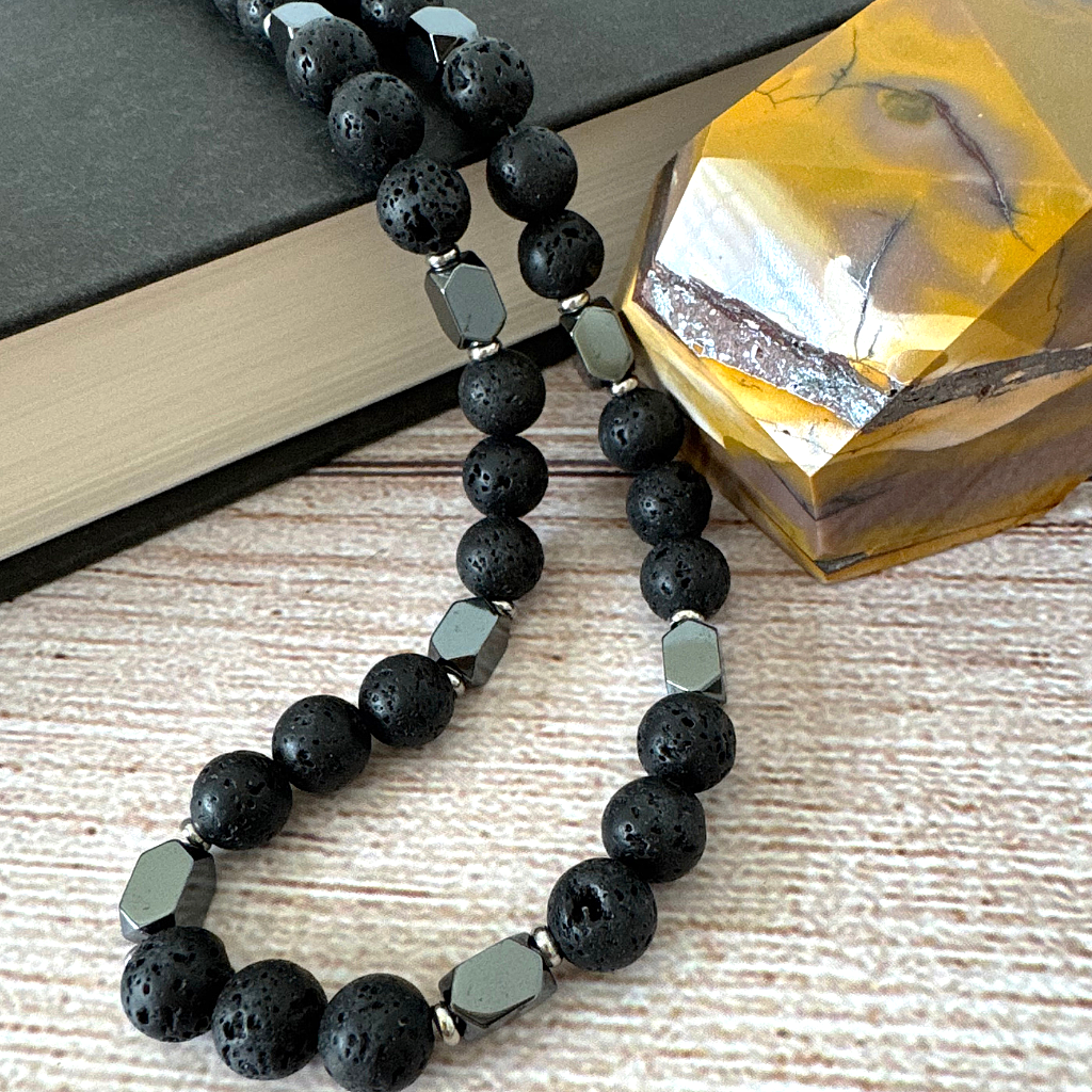Mens Black Lava and Hematite Rectangle Beaded Necklace On Table.
