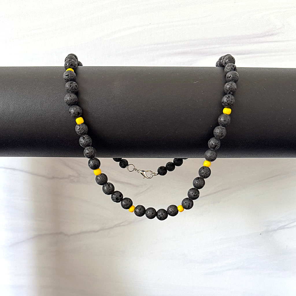 Mens Black Lava and Yellow Toho Beaded Necklace On A Bar.