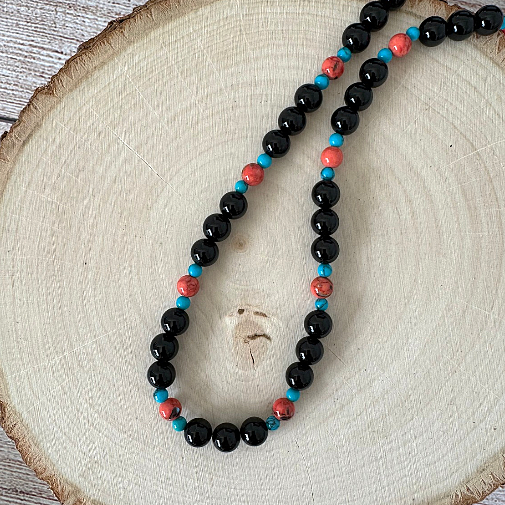 Mens Black Onyx Vermillion and Blue Howlite Beaded Necklace On Lighet Wood