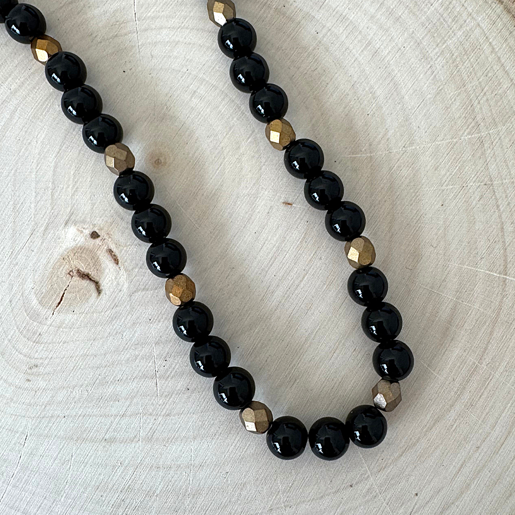 Mens Black Onyx and Czech Matte Metallic Gold Copper Beaded Necklace On Light Wood