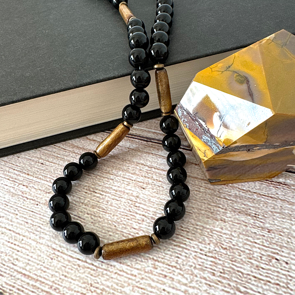 Mens Black Onyx and Gold Coral Beaded Necklace Displayed.