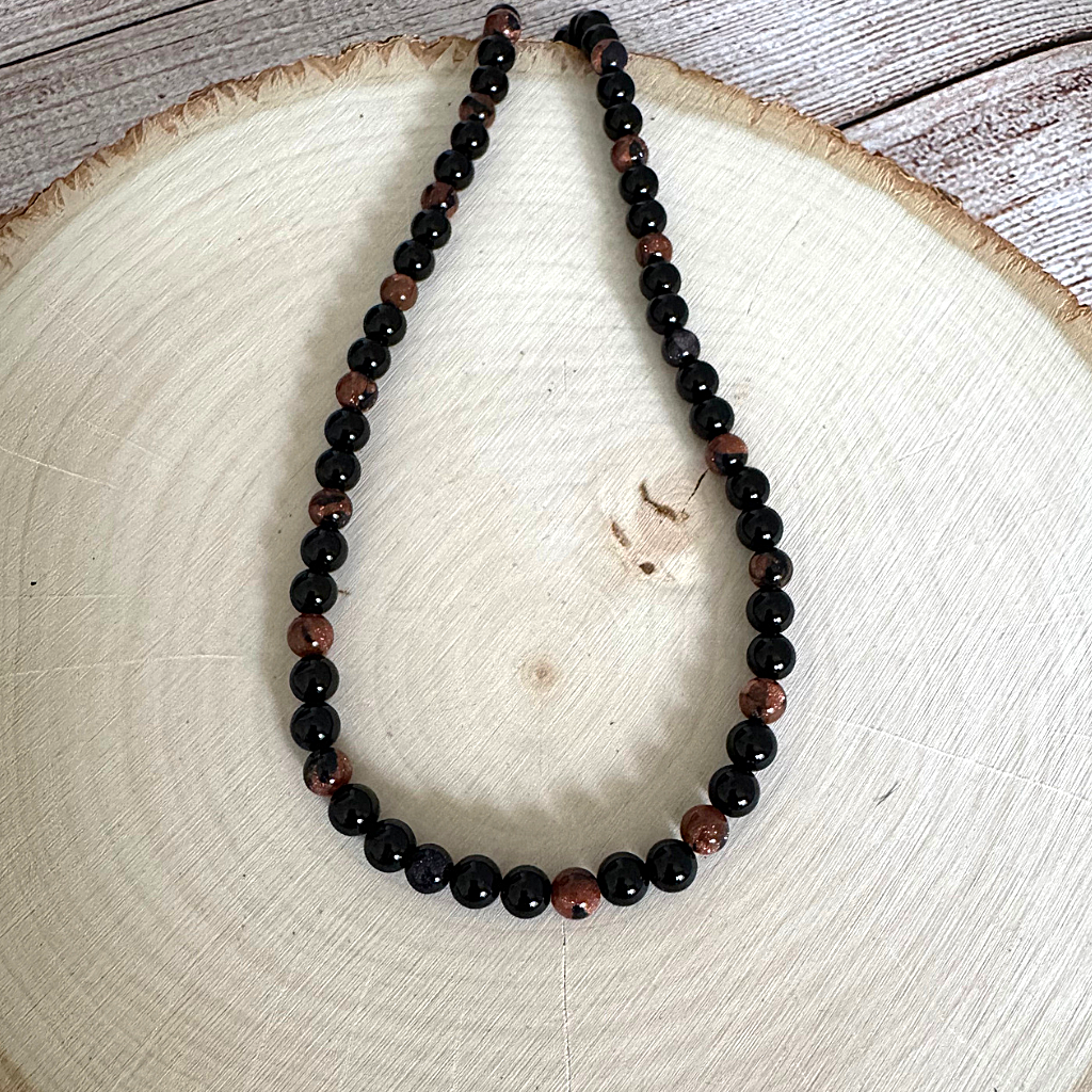 Mens Black Onyx and Goldstone Beaded Necklace On Wood
