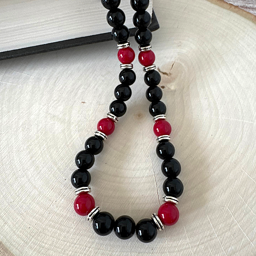Mens Black Onyx and Red Agate Beaded Necklace On Wood.