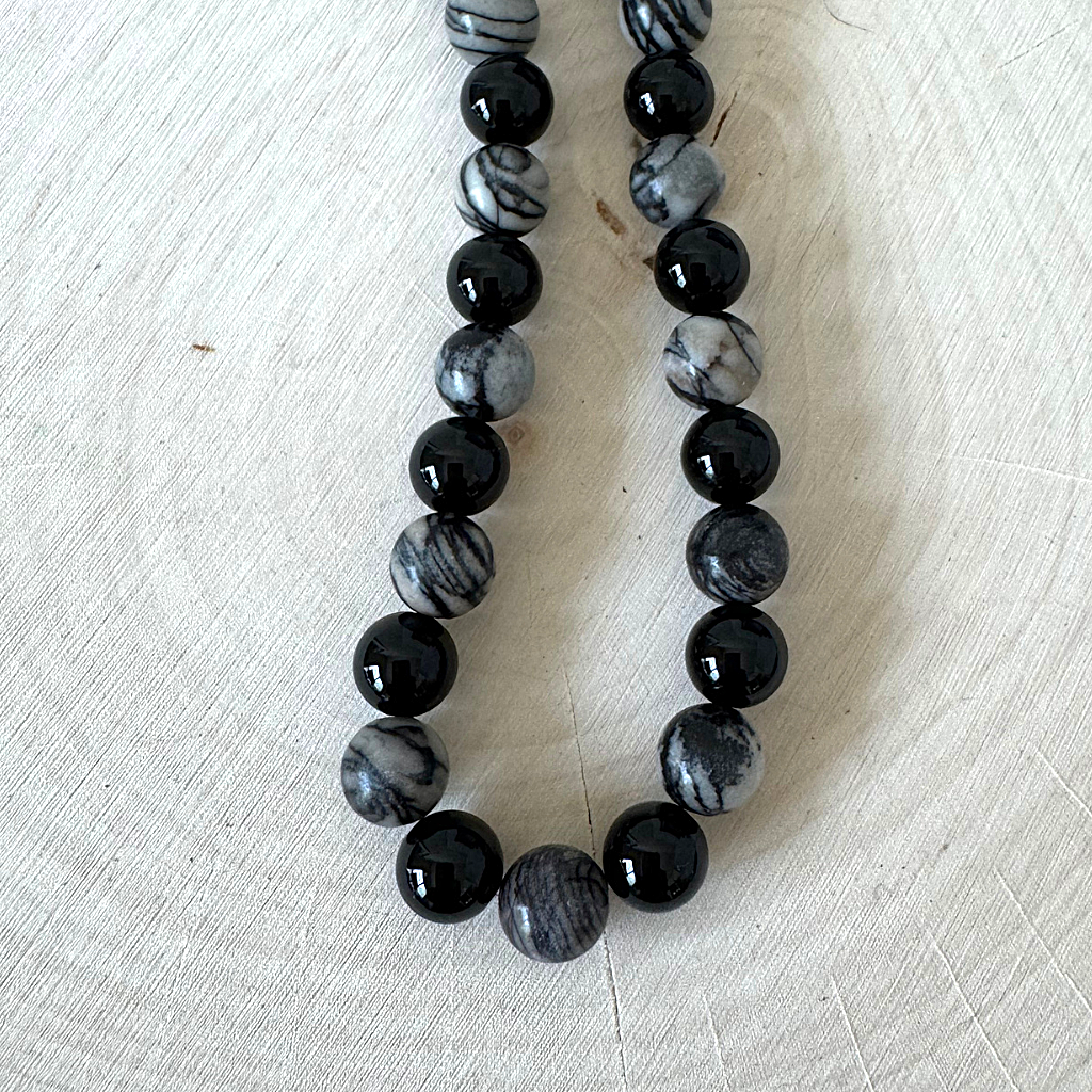 Mens Black Water Jasper and Black Onyx Beaded Necklace On Light Wood