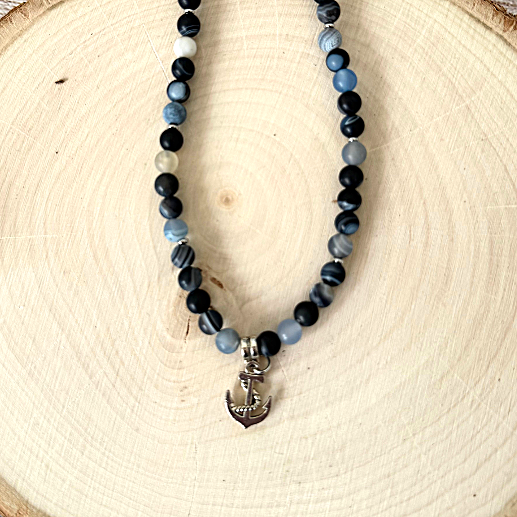 Mens Blue Storm Line Matte Agate Beaded Necklace and Silver Anchor On Light Wood