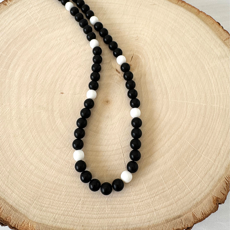 Mens Matte Black Onyx and White Czech Beaded Necklace Displayed