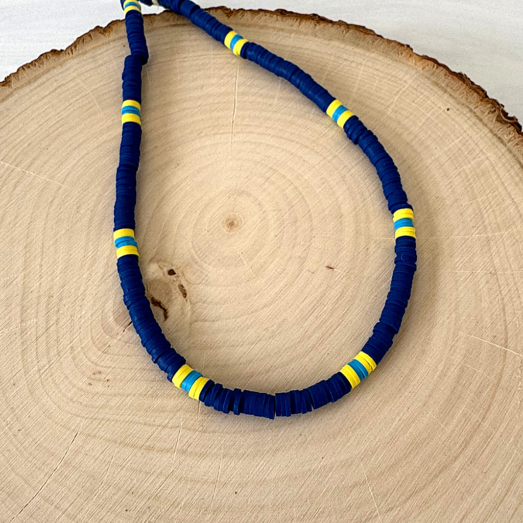 Mens Navy Blue Yellow and Light Blue Polymer Beaded Necklace On A Display