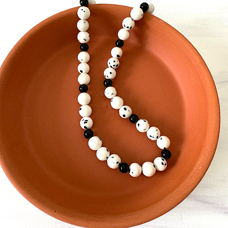 Mens White Dalmation Agate and Black Onyx Beaded Necklace On Display.