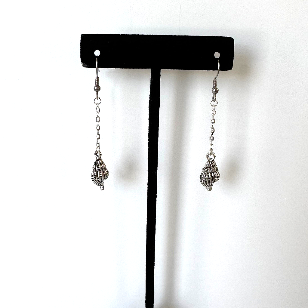 Silver Seashell Dangle Earrings On a Stand.