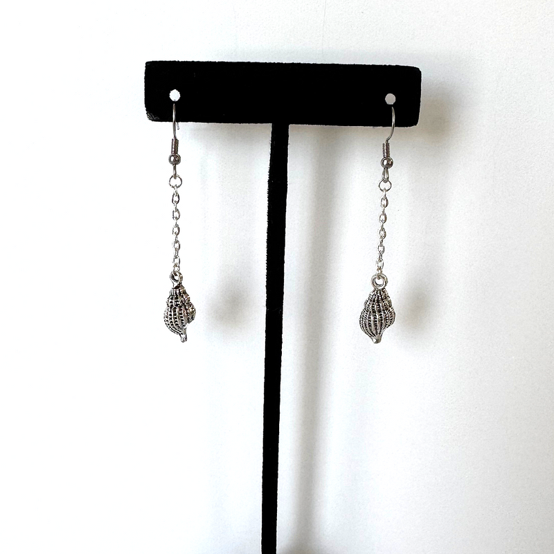 Silver Seashell Dangle Earrings On a Stand.