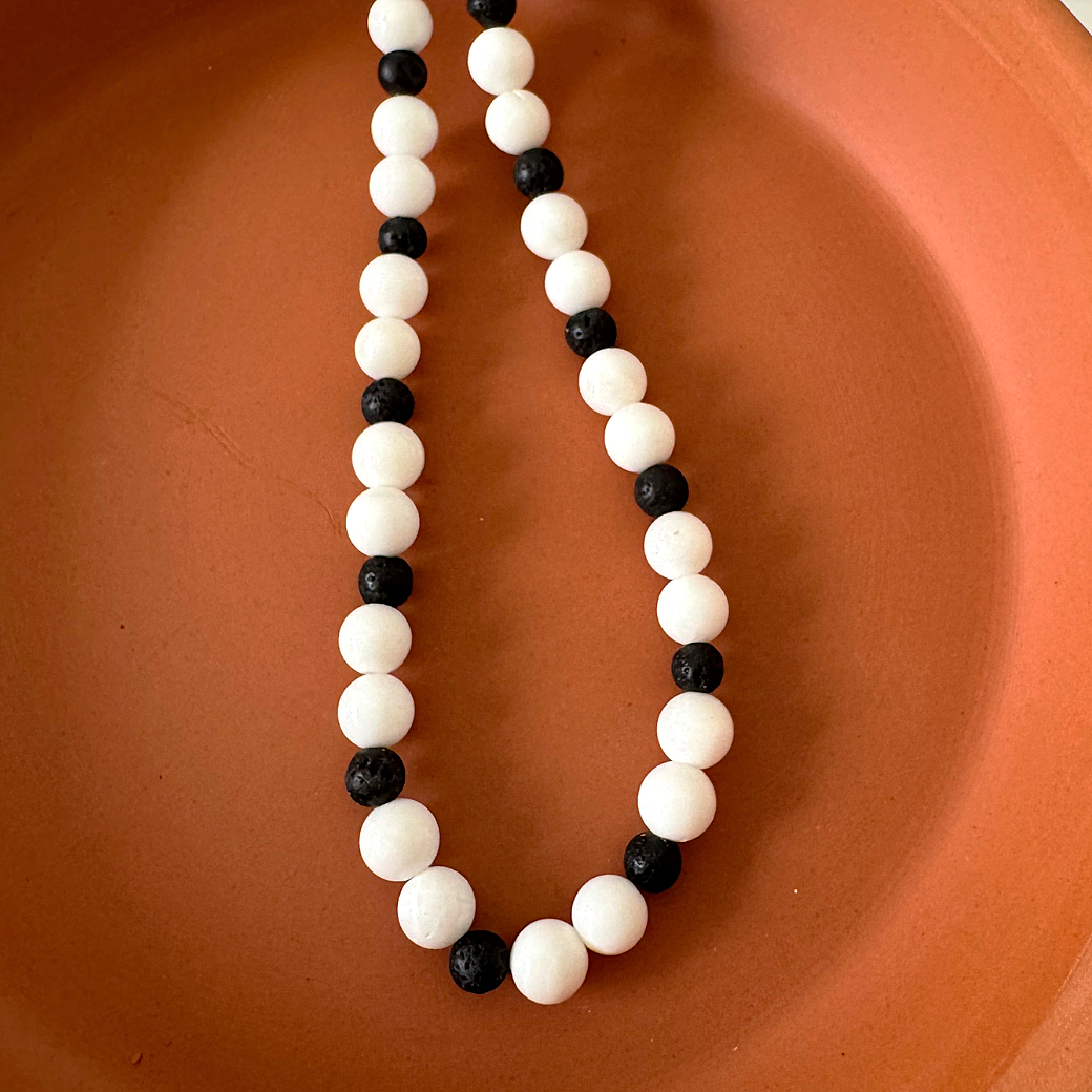 White Shell and Black Lava Mens Beaded Necklace Displayed