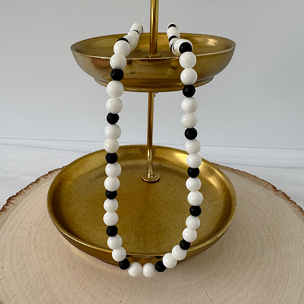 White Shell and Black Lava Mens Beaded Necklace On A Gold Tray