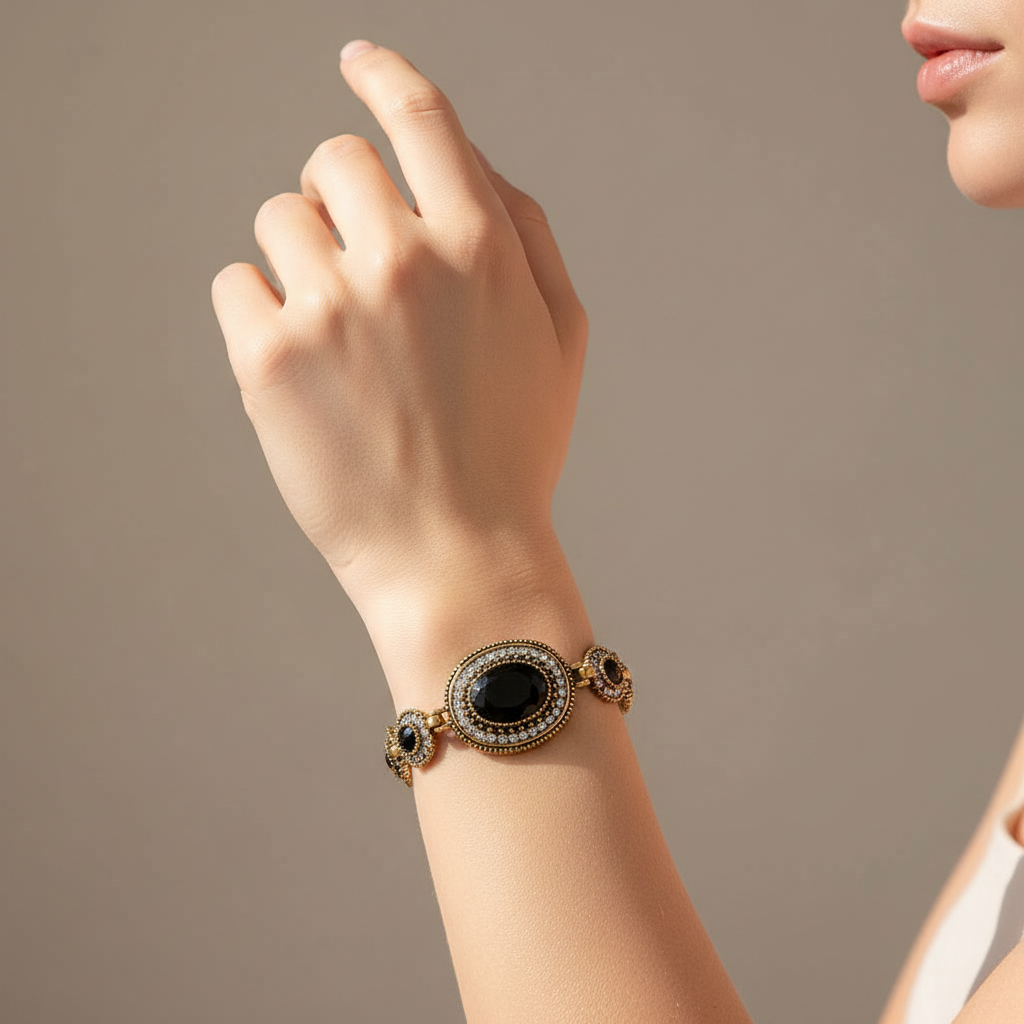 Black Crystal and Gold Link Antique Bracelet On A Womans Wrist.