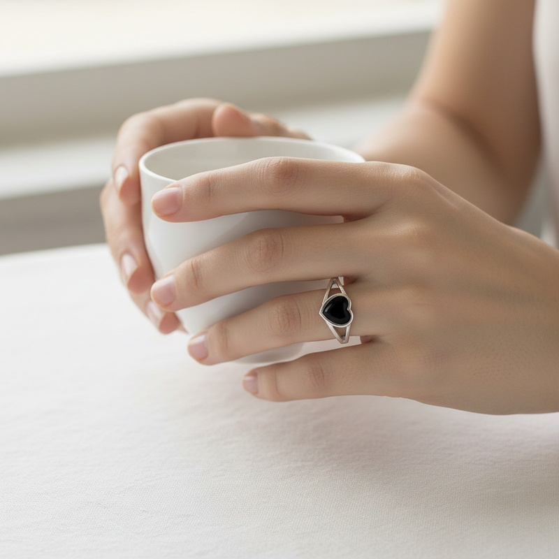 Black Onyx Heart Ring On a Hand.