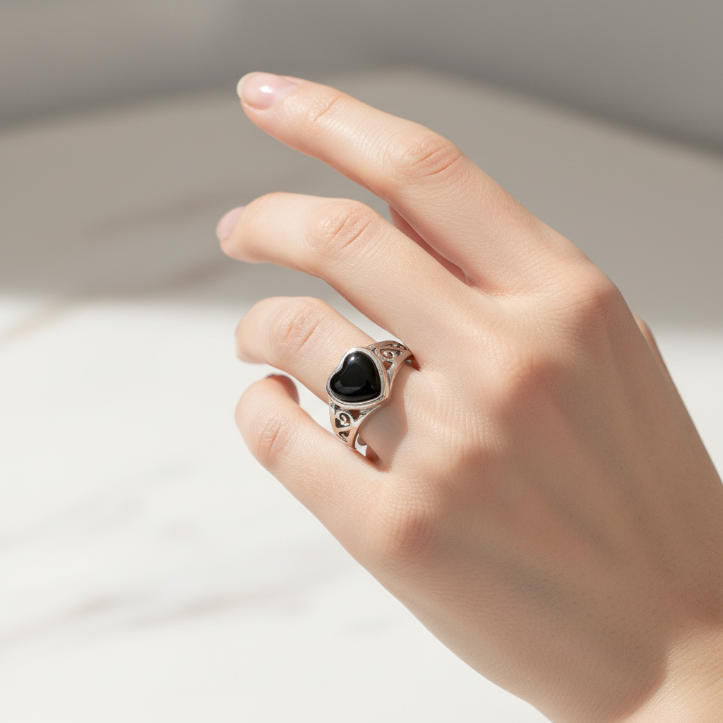 Black Onyx Heart Ring On a Hand.