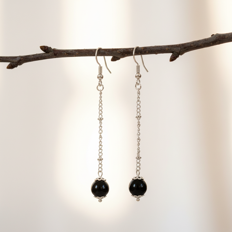 Black Onyx Long Dangle Earrings on tree branch.