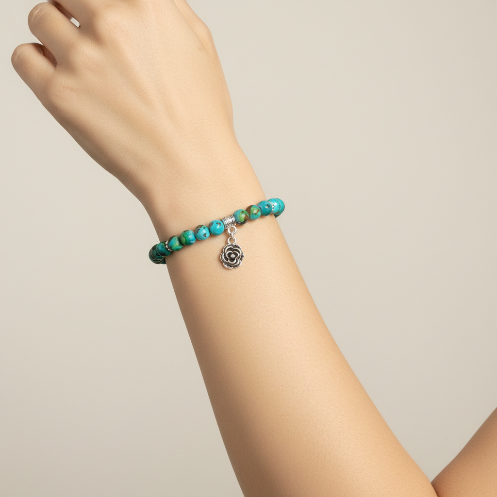 Turquoise Glass and Silver Flower Beaded Bracelet On A  Woman's Wrist