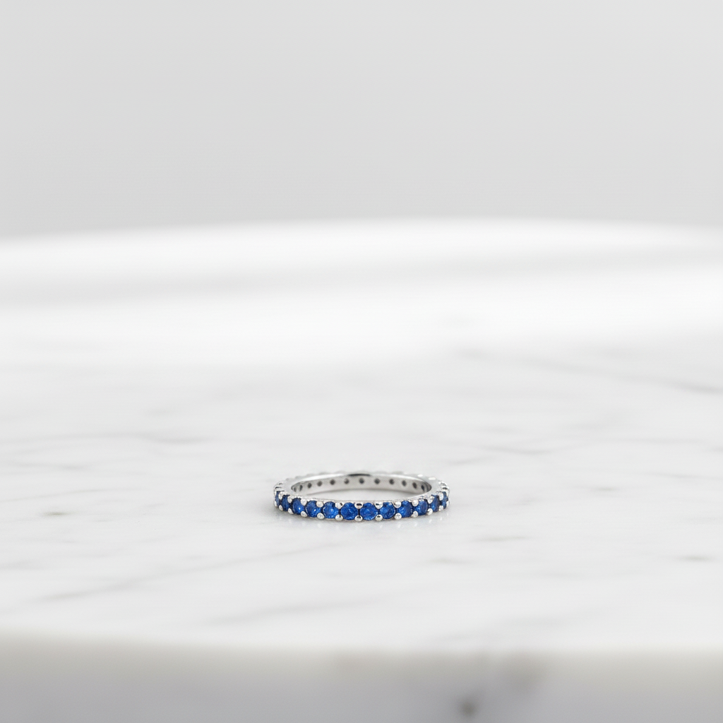 Blue Sapphire CZ Ring On Marble Table