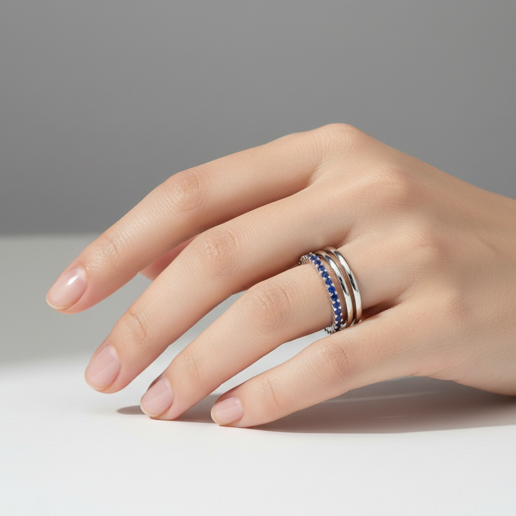 Blue Sapphire Stackable Ring On a Hand.