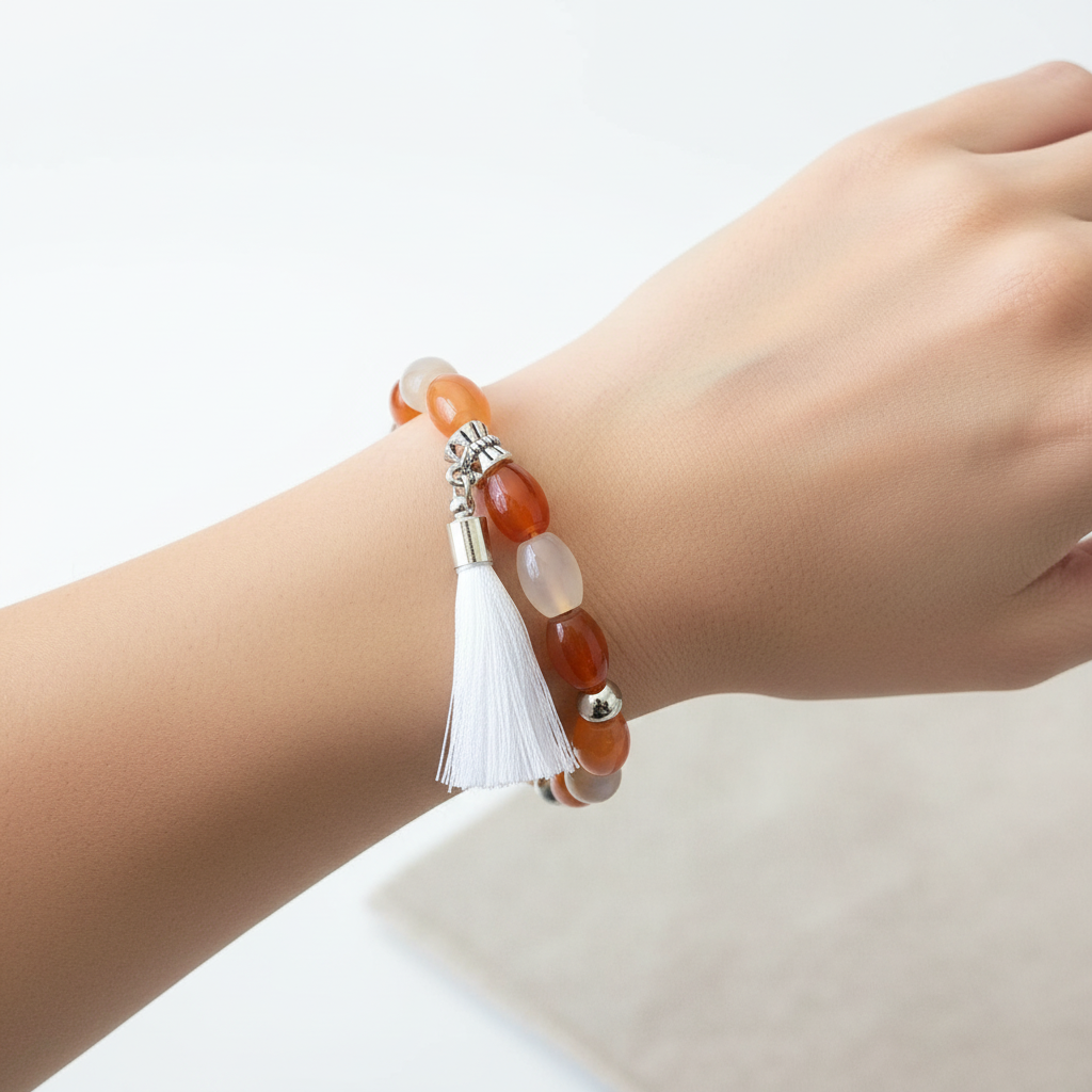 Red Agate and White Tassel Beaded Bracelet on a Wrist