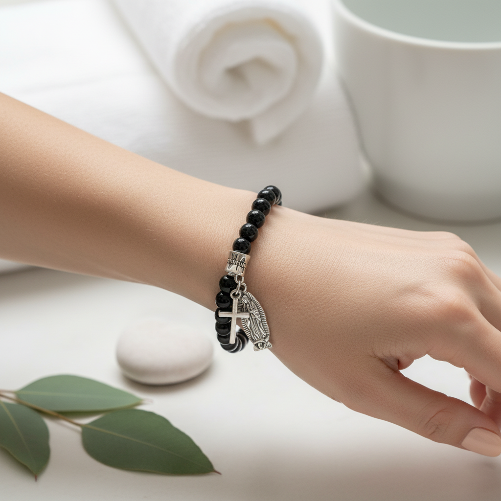 Black Onyx and Silver Saint Mary and Cross Charm Beaded Bracelet On a womans wrist