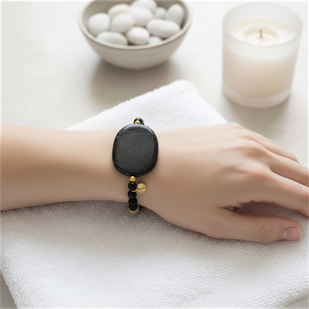 Black Marble Stone with Black Onyx and Gold Beaded Bracelet On a Womans Wrist.