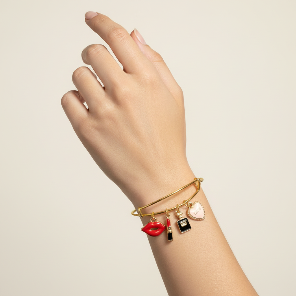 Gold Bangle Beauty Charm Bracelet on woman's wrist.