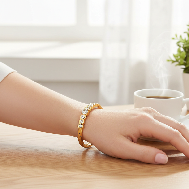 Gold Bangle Bracelet with Round Crystals On A Womans Wrist.