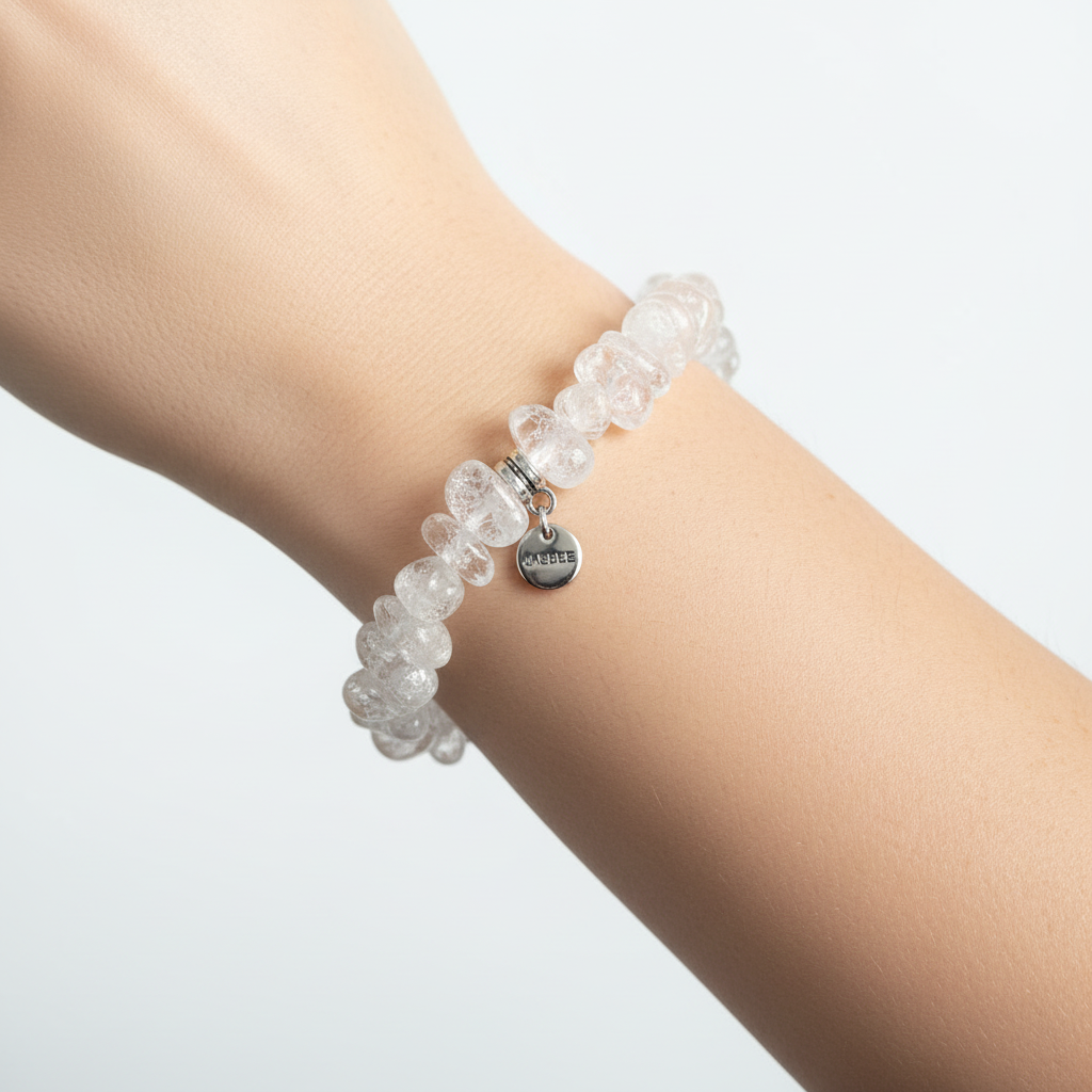 Clear Quartz Crackle Bracelet On A Wrist.