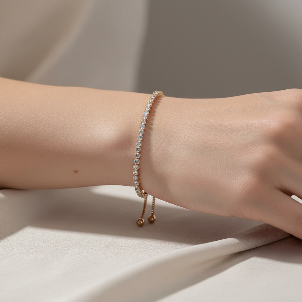 Crystal Adjustable Gold Tennis Bracelet On A Womans Wrist.