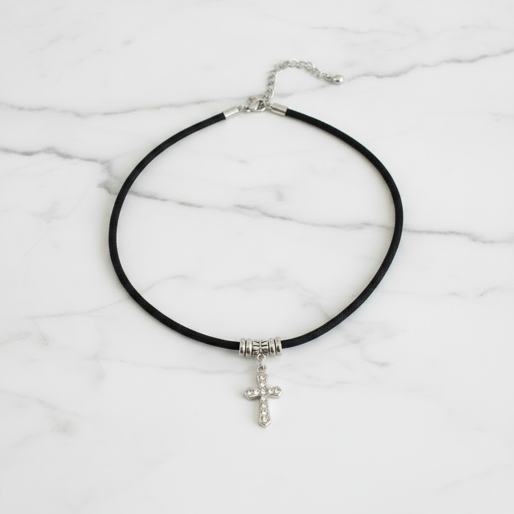 Crystal Silver Cross Choker On A Table