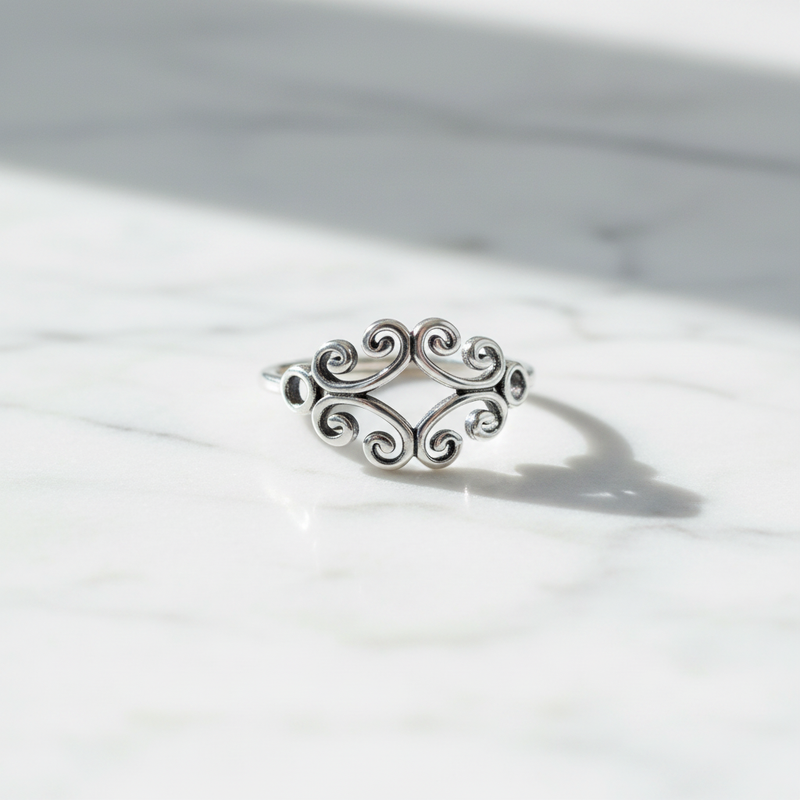 Fancy Sterling Silver Cut Out Ring on Table