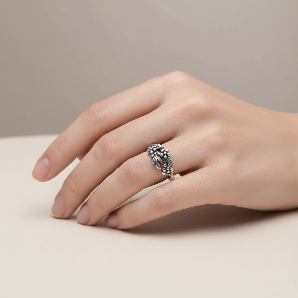 Flowers Nestled on Leaves Ring On A Hand.