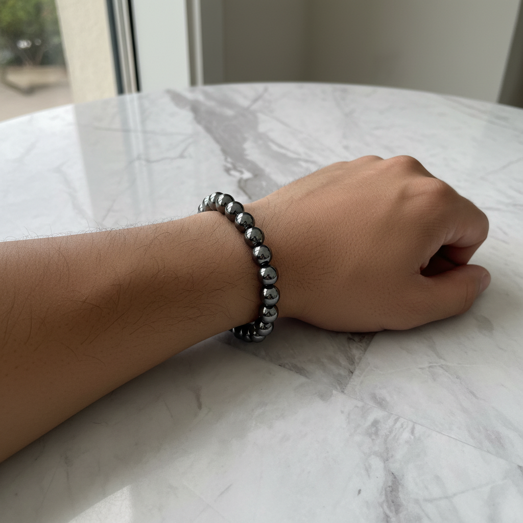 Men's 8mm Hematite Beaded Bracelet On Mans Wrist.