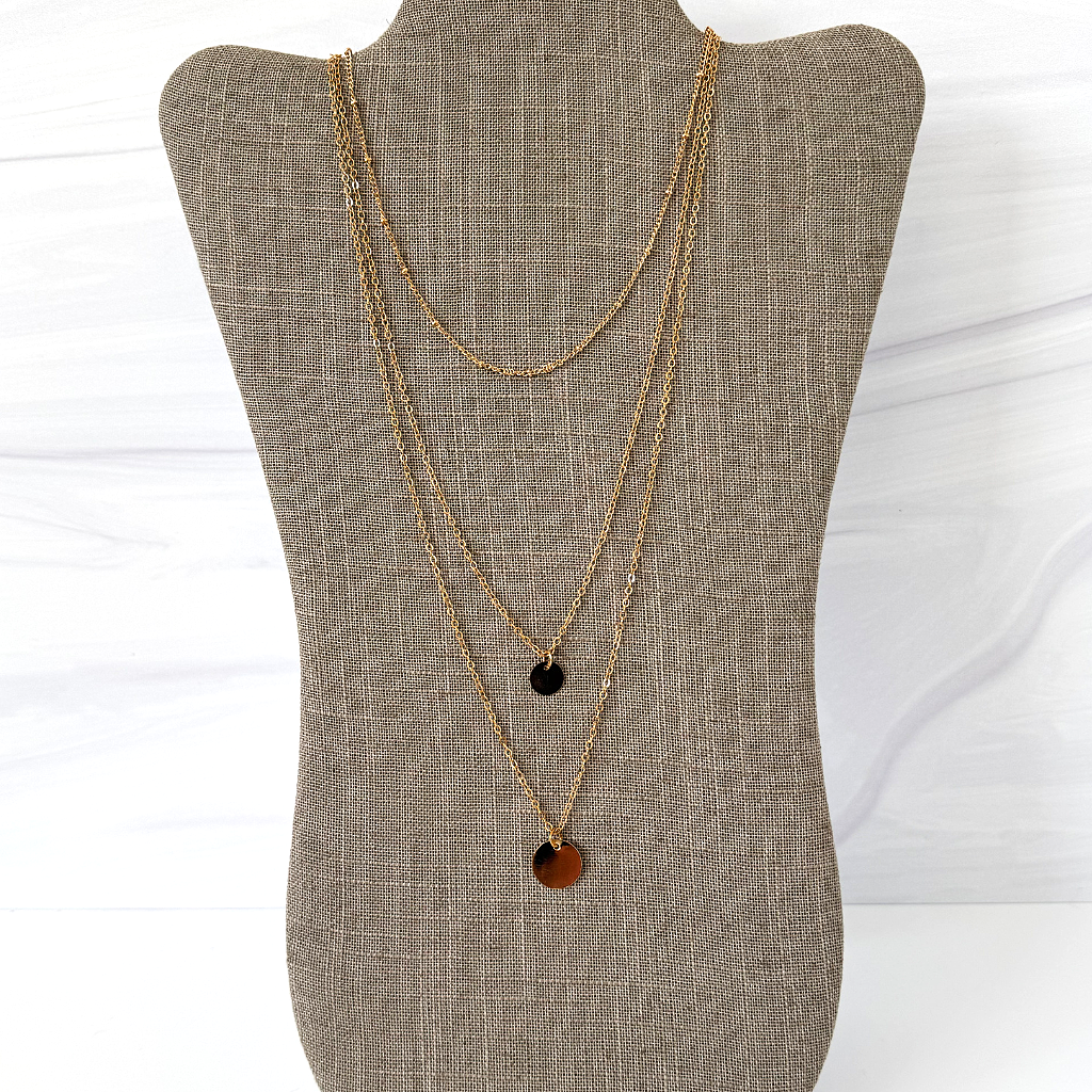 Gold Triple Layered Long Disc Necklace. Measures 15", 20" and 22" long.