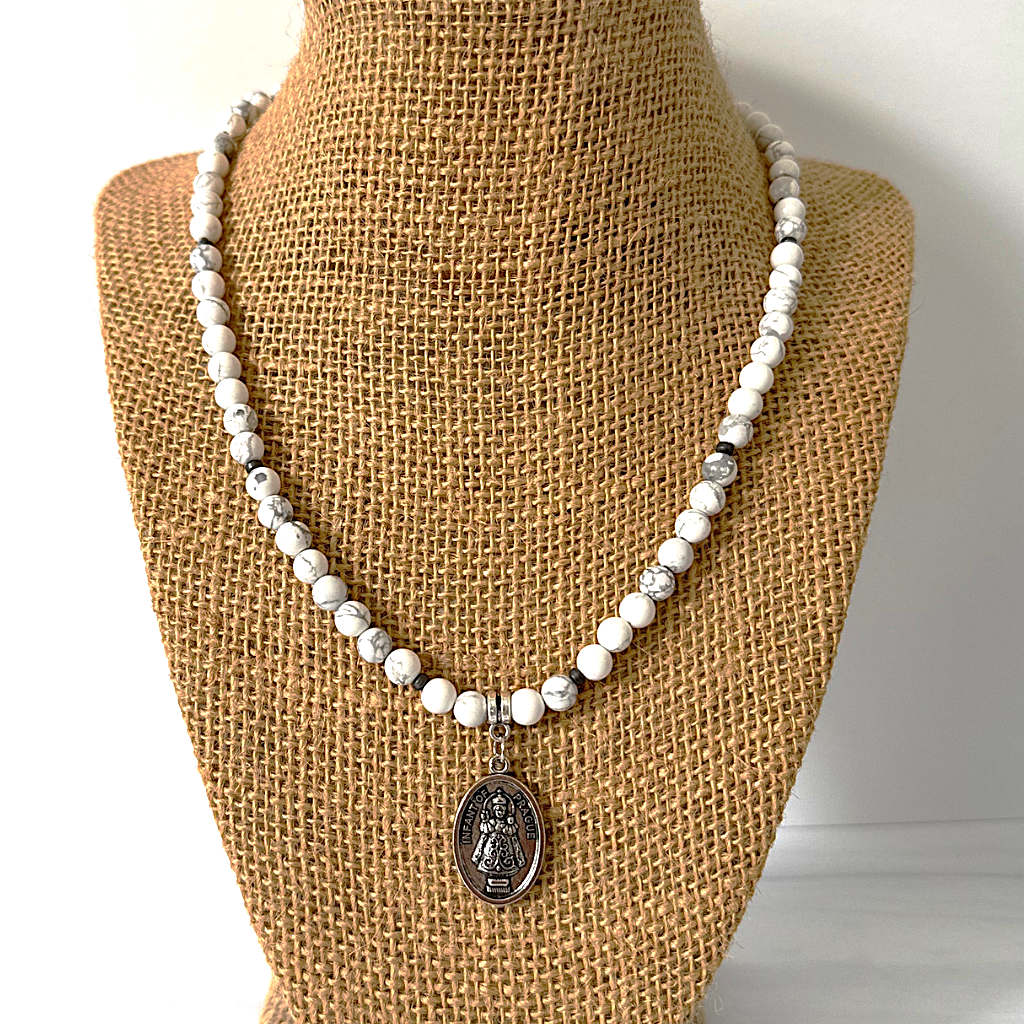 Mens 6mm White Howlite and Hematite Infant of Prague Beaded Necklace Displayed