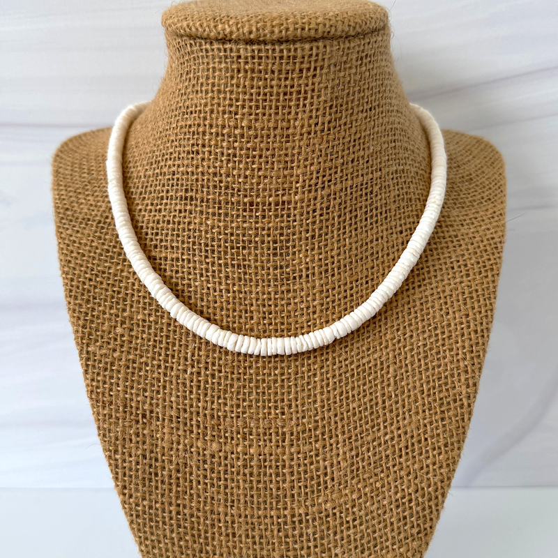 Mens White Shell Heishi Beaded Necklace On A Display.