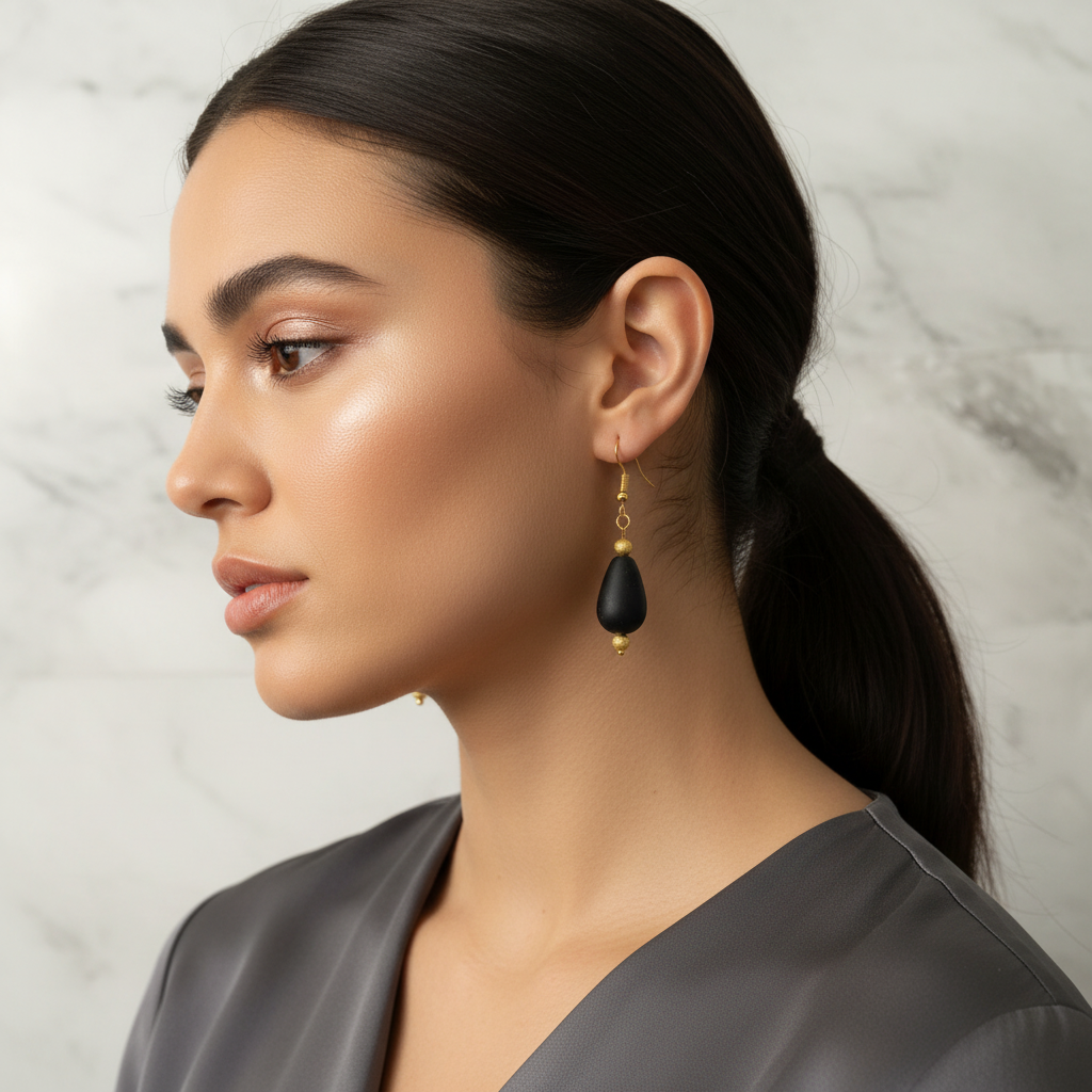 Jet Black Glass and Gold Teardrop Earrings on Model.