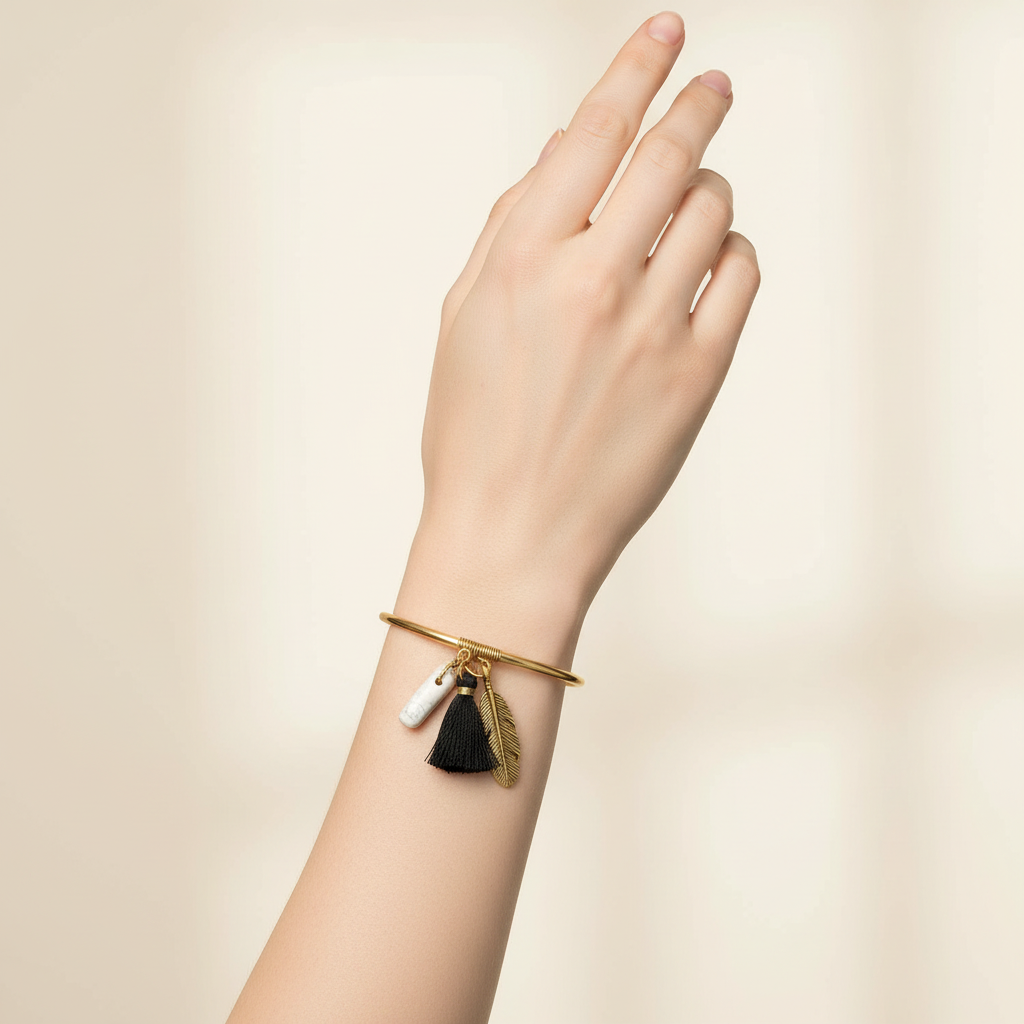 Leaf, Stone & Black Tassel Bracelet On A Womans Hand.