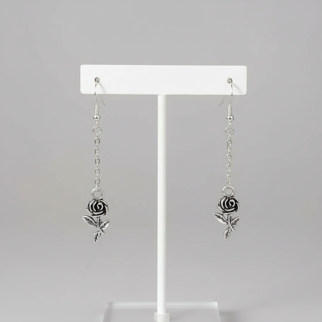 Rose Dangle Earrings On Jewelry Display.